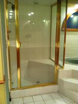 old framed glass shower door before